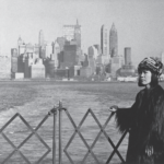 Yayoi Kusama in Brooklyn with a view of Manhattan, 1964